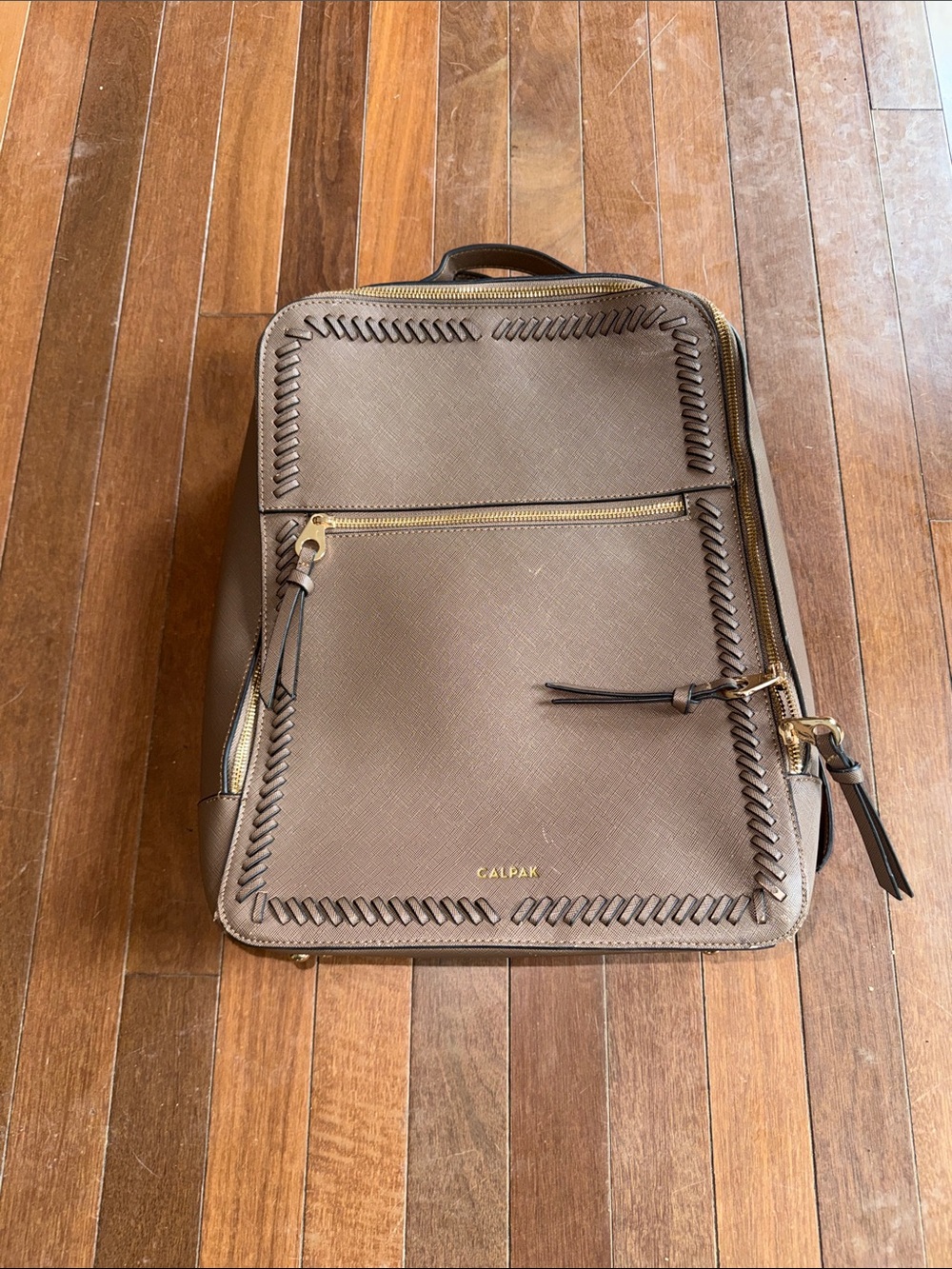 Calpak Brown Leather Backpack with Whipstitch Trim and Gold Hardware